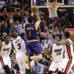 Phoenix Suns guard Devin Booker (1) goes to the basket against the Miami Heat during the second half of an NBA basketball game, Thursday, March 3, 2016, in Miami. (AP Photo/Alan Diaz)