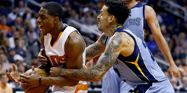 Memphis Grizzlies forward Matt Barnes, right, fouls Phoenix Suns guard Brandon Knight during the se...
