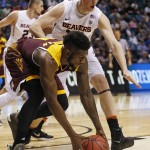 Arizona State forward Savon Goodman grabs the ball by Oregon State forward Olaf Schaftenaar during the first half of an NCAA college basketball game in the first round of the Pac-12 men's tournament Wednesday, March 9, 2016, in Las Vegas. (AP Photo/John Locher)