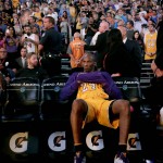 
              Los Angeles Lakers forward Kobe Bryant (24) sits alone on the bench after being introduced prior to an NBA basketball game against the Phoenix Suns, Wednesday, March 23, 2016, in Phoenix. (AP Photo/Matt York)
            