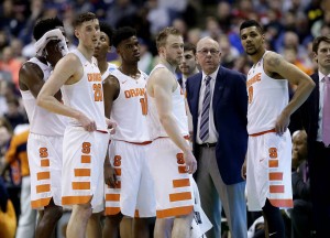 Syracuse head coach Jim Boeheim stands with his players while a play is reviewed during the first half of a second-round men's college basketball game against Middle Tennessee in the NCAA Tournament, Sunday, March 20, 2016, in St. Louis. (AP Photo/Charlie Riedel)