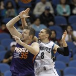 Minnesota Timberwolves guard Zach LaVine (8) swats the ball away from Phoenix Suns forward Mirza Teletovic (35), of Bosnia, during the second half of an NBA basketball game in Minneapolis, Monday, March 28, 2016. The Timberwolves won 121-116. (AP Photo/Ann Heisenfelt)