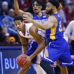 Oklahoma guard Isaiah Cousins, left, is double teamed by Cal State Bakersfield forward Matt Smith, center, and guard Justin Pride, right, in the first half of a first-round men's college basketball game in the NCAA Tournament, Friday, March 18, 2016, in Oklahoma City. Oklahoma 82-68. (AP Photo/Alonzo Adams)