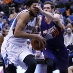 Phoenix Suns forward Jon Leuer (30) hits Minnesota Timberwolves center Karl-Anthony Towns, left, in the eyes as Towns drives to the basket during the second half of an NBA basketball game in Minneapolis, Monday, March 28, 2016. The Timberwolves won 121-116. (AP Photo/Ann Heisenfelt)