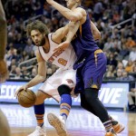 New York Knicks' Robin Lopez (8) backs down Phoenix Suns' Alex Len during the first half of an NBA basketball game, Wednesday, March 9, 2016, in Phoenix. (AP Photo/Matt York)