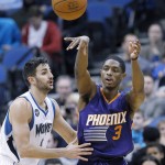 Phoenix Suns guard Brandon Knight (3) passes to a teammate under pressure from Minnesota Timberwolves guard Ricky Rubio, left, of Spain, during the second half of an NBA basketball game in Minneapolis, Monday, March 28, 2016. The Timberwolves won 121-116. (AP Photo/Ann Heisenfelt)