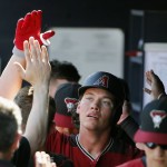 Arizona Diamondbacks' Peter O'Brien celebrates his two-run home run against the San Diego Padres with teammates during the second inning of a spring training baseball game, Tuesday, March 8, 2016, in Peoria, Ariz. (AP Photo/Ross D. Franklin)