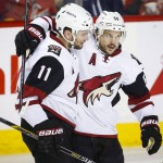 Arizona Coyotes' Antoine Vermette, right, celebrates his goal with Martin Hanzal, of Czech Republic, during the third period of an NHL hockey game against the Calgary Flames, Friday, March 11, 2016, in Calgary, Alberta. (Jeff McIntosh/The Canadian Press via AP) MANDATORY CREDIT