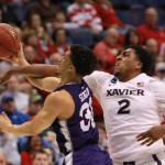 Xavier forward James Farr, right, fouls Weber State guard Jeremy Senglin during the first half of an NCAA college basketball game in the NCAA men's tournament, Friday, March 18, 2016, in St. Louis. (Chris Lee/St. Louis Post-Dispatch via AP)