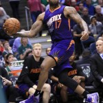 Phoenix Suns forward P.J. Tucker tries to save a loose ball during the second half of the team's NBA basketball game against the Milwaukee Bucks on Wednesday, March 30, 2016, in Milwaukee. (AP Photo/Darren Hauck)