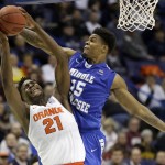 Syracuse's Tyler Roberson, left, is fouled on his way to the basket by Middle Tennessee's Aldonis Foote during the second half of a second-round men's college basketball game in the NCAA Tournament, Sunday, March 20, 2016, in St. Louis. Syracuse won 75-50. (AP Photo/Jeff Roberson)