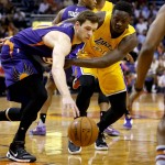 Phoenix Suns forward Jon Leuer, left, steals the ball from Los Angeles Lakers forward Julius Randle, right, during the first half of an NBA basketball game, Wednesday, March 23, 2016, in Phoenix. (AP Photo/Matt York)