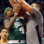 Boston Celtics guard Isaiah Thomas, left, gets fouled by Phoenix Suns center Alex Len, right, in the third quarter during an NBA basketball game, Saturday, March 26, 2016, in Phoenix. The Celtics defeated the Suns 102-99. (AP Photo/Rick Scuteri)