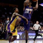 Phoenix Suns guard Brandon Knight, right, is fouled by Los Angeles Lakers guard Lou Williams during the first half of an NBA basketball game in Los Angeles, Friday, March 18, 2016. (AP Photo/Chris Carlson)
