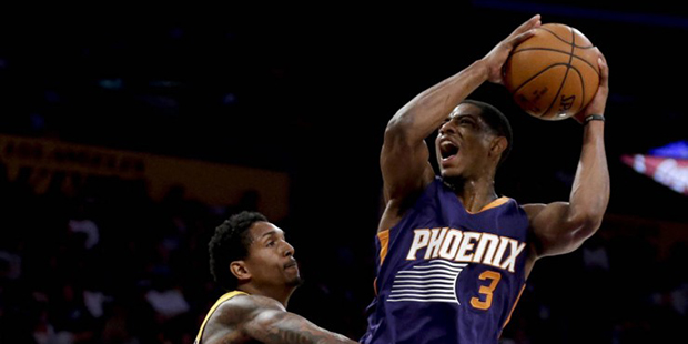 Phoenix Suns guard Brandon Knight, right, is fouled by Los Angeles Lakers guard Lou Williams during...
