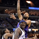 Memphis Grizzlies forward Zach Randolph, bottom center, calls to a referee as a play is whistled dead before Phoenix Suns center Tyson Chandler, top, completes a shot in the first half of an NBA basketball game Sunday, March 6, 2016, in Memphis, Tenn. (AP Photo/Brandon Dill)