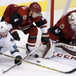 Arizona Coyotes' Mike Smith (41) makes a save on a shot by San Jose Sharks' Chris Tierney (50) as Coyotes' Zbynek Michalek (4), of the Czech Republic, defends during the third period of an NHL hockey game Thursday, March 17, 2016, in Glendale, Ariz. The Coyotes defeated the Sharks 3-1. (AP Photo/Ross D. Franklin)