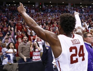Oklahoma guard Buddy Hield (24) gestures to the Oklahoma crowd following a second-round men's college basketball game in the NCAA Tournament Sunday, March 20, 2016, in Oklahoma City. Oklahoma won 85-81. (AP Photo/Alonzo Adams)
