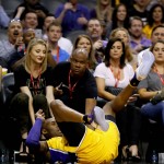 Los Angeles Lakers forward Kobe Bryant (24) falls after being fouled against the Phoenix Suns during the first half of an NBA basketball game, Wednesday, March 23, 2016, in Phoenix. (AP Photo/Matt York)