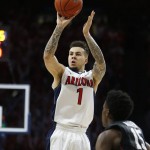 Arizona guard Gabe York (1) shoots over Stanford guard Marcus Allen during the second half of an NCAA college basketball game, Saturday, March 5, 2016, in Tucson, Ariz. (AP Photo/Rick Scuteri)