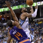 Memphis Grizzlies guard Mike Conley (11) shoots against Phoenix Suns guard Ronnie Price (14) in the second half of an NBA basketball game Sunday, March 6, 2016, in Memphis, Tenn. (AP Photo/Brandon Dill)