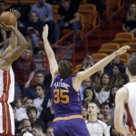 Miami Heat center Hassan Whiteside (21) shoots as Phoenix Suns forward Mirza Teletovic (35) defends during the first half of an NBA basketball game, Thursday, March 3, 2016, in Miami. (AP Photo/Alan Diaz)