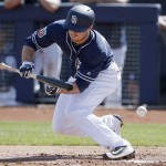 San Diego Padres' Cory Spangenberg fouls off a bunt attempt during the first inning of a spring training baseball game against the Arizona Diamondbacks Tuesday, March 8, 2016, in Peoria, Ariz. (AP Photo/Ross D. Franklin)