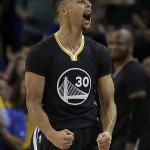 Golden State Warriors' Stephen Curry celebrates a score in the final seconds of the team's NBA basketball game against the against the Phoenix Suns on Saturday, March 12, 2016, in Oakland, Calif. (AP Photo/Ben Margot)
