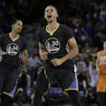 Golden State Warriors' Stephen Curry (30) celebrates a score in the final seconds of the team's NBA basketball game against the against the Phoenix Suns on Saturday, March 12, 2016, in Oakland, Calif. (AP Photo/Ben Margot)