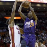 Phoenix Suns guard Archie Goodwin (20) prepares to shoot against Miami Heat center Hassan Whiteside (21) during the first half of an NBA basketball game, Thursday, March 3, 2016, in Miami. (AP Photo/Alan Diaz)