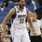Minnesota Timberwolves center Karl-Anthony Towns (32) reacts after making a shot against the Phoenix Suns during the first half of an NBA basketball game in Minneapolis, Monday, March 28, 2016. (AP Photo/Ann Heisenfelt)