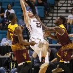 Oregon State center Gligorije Rakocevic, center, grabs a rebound between Arizona State forwards Obinna Oleka, left, and Savon Goodman, right, during the first half of an NCAA college basketball game in the first round of the Pac-12 men's tournament Wednesday, March 9, 2016, in Las Vegas. (AP Photo/John Locher)