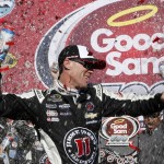 Kevin Harvick celebrates with crew members in victory lane after winning a NASCAR Sprint Cup Series auto race at Phoenix International Raceway, Sunday, March 13, 2016, in Avondale, Ariz. (AP Photo/Ross D. Franklin)