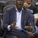 Charlotte Hornets owner Michael Jordan argues a call with a referee during the first half of the Hornets' NBA basketball game against the Phoenix Suns in Charlotte, N.C., Tuesday, March 1, 2016. (AP Photo/Chuck Burton)