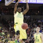 Oregon forward Elgin Cook (23) dunks during the second half of a first-round men's college basketball game in the NCAA Tournament against Holy Cross in Spokane, Wash., Friday, March 18, 2016. (AP Photo/Young Kwak)