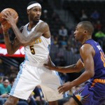 Denver Nuggets forward Will Barton, left, looks to pass the ball as Phoenix Suns guard Ronnie Price defends during the second half of an NBA basketball game Thursday, March 10, 2016, in Denver. The Nuggets won 116-98. (AP Photo/David Zalubowski)