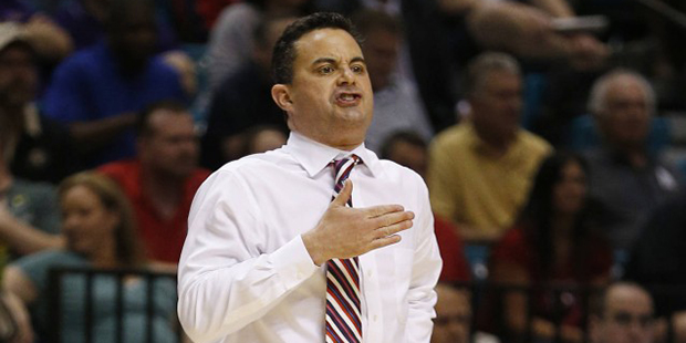 Arizona coach Sean Miller motions to his players during the second half of an NCAA college basketba...