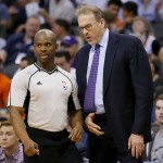 New York Knicks head coach Kurt Rambis talks with the referee during the first half of an NBA basketball game against the Phoenix Suns, Wednesday, March 9, 2016, in Phoenix. (AP Photo/Matt York)