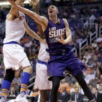 Phoenix Suns' Alex Len drives against New York Knicks' Robin Lopez, left, during the second half of an NBA basketball game, Wednesday, March 9, 2016, in Phoenix. (AP Photo/Matt York)