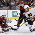 Arizona Coyotes' Mike Smith (41) makes a save on a shot by Philadelphia Flyers' Ryan White (25) as Coyotes' Connor Murphy (5) defends during the second period of an NHL hockey game Saturday, March 26, 2016, in Glendale, Ariz. The Coyotes defeated the Flyers 2-1. (AP Photo/Ross D. Franklin)