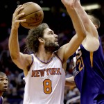 New York Knicks' Robin Lopez (8) shoots over Phoenix Suns' Alex Len during the first half of an NBA basketball game, Wednesday, March 9, 2016, in Phoenix. (AP Photo/Matt York)
