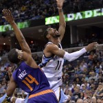 Memphis Grizzlies guard Mike Conley (11) shoots against Phoenix Suns guard Ronnie Price (14) in the second half of an NBA basketball game Sunday, March 6, 2016, in Memphis, Tenn. (AP Photo/Brandon Dill)