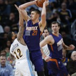 Denver Nuggets guard D.J. Augustin, left, defends Phoenix Suns center Alex Len, center, of Ukraine, as forward Mirza Teletovic, right, watches during the second half of an NBA basketball game Thursday, March 10, 2016, in Denver. The Nuggets won 116-98. (AP Photo/David Zalubowski)