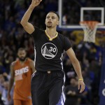 Golden State Warriors' Stephen Curry celebrates a score against the Phoenix Suns during the second half of an NBA basketball game Saturday, March 12, 2016, in Oakland, Calif. (AP Photo/Ben Margot)