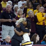 Arizona State head coach Charli Turner Thorne embraces guard Elisha Davis after she fouled out during the second half of a second-round NCAA women's college basketball game against Tennessee, Sunday, March 20, 2016, in Tempe, Ariz. Tennessee won 75-64. (AP Photo/Matt York)