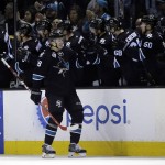 San Jose Sharks' Tomas Hertl (48) celebrates his goal with teammates during the second period of an NHL hockey game against the Arizona Coyotes Sunday, March 20, 2016, in San Jose, Calif. (AP Photo/Marcio Jose Sanchez)