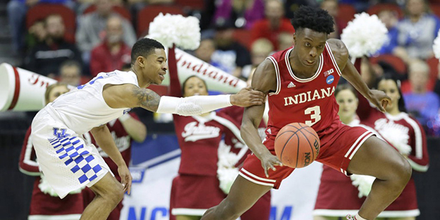 Indiana forward OG Anunoby, right, is fouled by Kentucky guard Tyler Ulis after stealing the ball d...