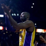 Los Angeles Lakers forward Kobe Bryant acknowledges the fans during a time out in the first half of an NBA basketball game against the Phoenix Suns, Wednesday, March 23, 2016, in Phoenix. (AP Photo/Matt York)