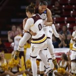 Arizona State's Sabrina Haines jumps into Katie Hempen (0) after Hempen hit a 3-pointer against New Mexico State during a college basketball game in the NCAA women's tournament, Friday, March 18, 2016, in Tempe, Ariz. (Patrick Breen/The Arizona Republic via AP)