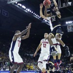 Wichita State forward Markis McDuffie (32) drives to the basket against Arizona during the first half of an NCAA college basketball game in the NCAA tournament in Providence, R.I., Thursday, March 17, 2016. (AP Photo/Charles Krupa)